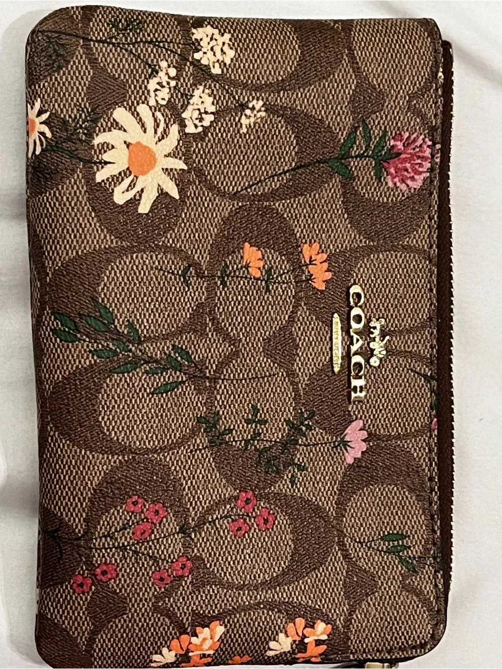 COACH Brown Signature Floral Wristlet with Gold Logo